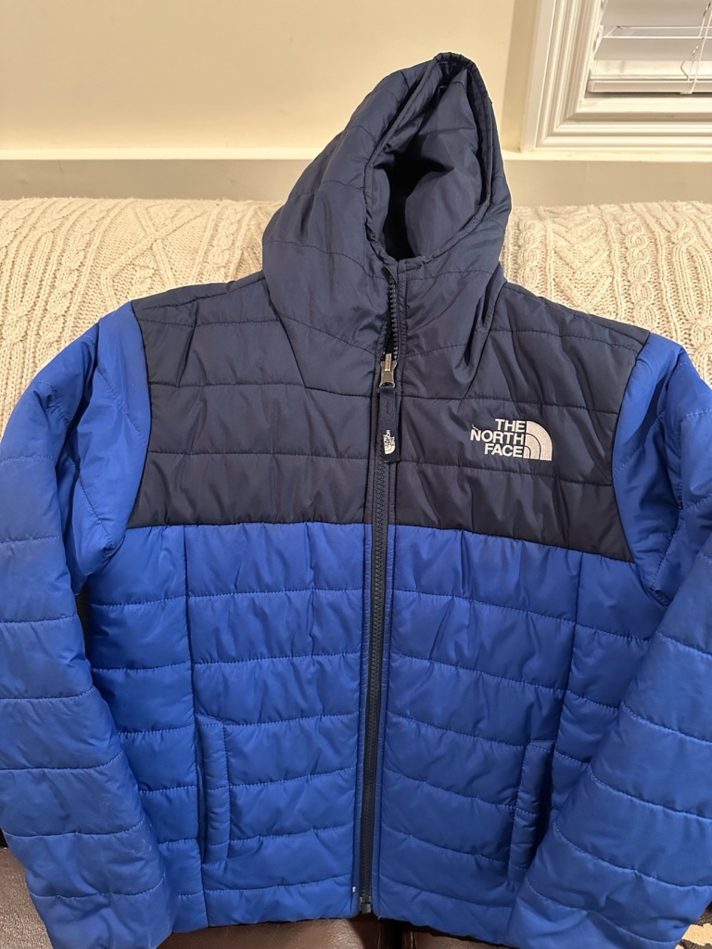 The North Face boy’s reversible jacket, size S.